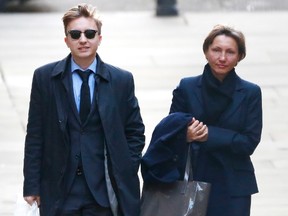 Marina Litvinenko, the widow of murdered KGB agent Alexander Litvinenko arrives with her son Anatoly at the High Court in central London February 2, 2015. (REUTERS/Andrew Winning)