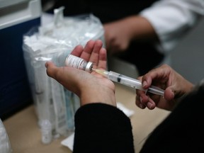 A health worker prepares a vaccine against measles. (REUTERS/Bernardo Montoya files)