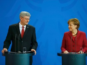 German Chancellor Angela Merkel and Prime Minister Stephen Harper address a joint news conference at the Chancellery in Berlin on March 27, 2014. (REUTERS/Kai Pfaffenbach)