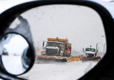 Traffic is hardly moving as Toronto gets hit with several centimetres of snow. Plows are pictured making there way across Sheppard Ave. on February 2, 2015. (Dave Thomas/QMI Agency)