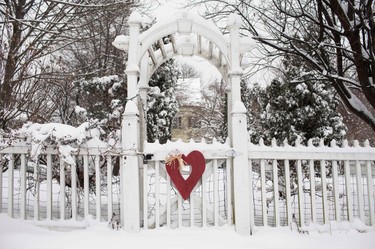 A wooden Heart decoration hangs on a snow covered gate to a home in the New York City suburb of South Nyack, New York, February 2, 2015. The northeastern United States braced for the second major snow storm in a week on Monday after a huge winter system dumped more than a foot (30 cm) of snow in the Chicago area, closing schools from the Midwest to New England. (REUTERS/Mike Segar)