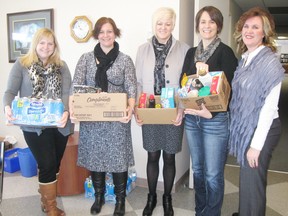 The Community Care Access Centre in Seaforth, where Five Drive founder Laura Johnston works, started a casual Friday donation program. Pictured with some of the donated items are (from left to right) Michele Dalton, Laura Johnston, Sharon Westberg, Alysson Korver and Shelley Bryson. (Contributed photo)