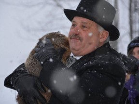 Oil Springs Mayor Ian Veen​ was wearing a top hat and heavy coat Monday as the village's most famous groundhog, Oil Springs Ollie, braved the elements to proclaim six more weeks of winter. (SUBMITTED PHOTO)