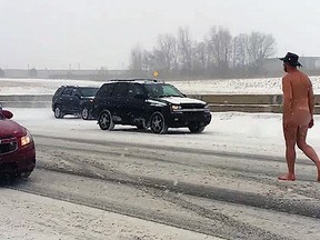 A man was spotted Sunday morning walking on I-75 wearing nothing but a cowboy hat. (YouTube)