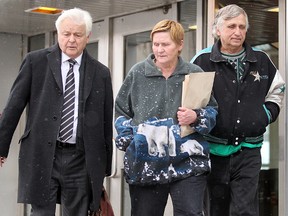 Lawyer Jay Prober (left) leaves the Law Courts in 2013 with clients Judy and Peter Chernecki. The two appealed their animal abuse sentences on Monday. (Brian Donogh/Winnipeg Sun file photo)