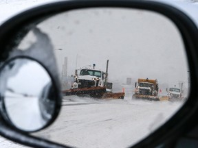 Plows make there way across a stretch of Sheppard Ave. on Monday. (DAVE THOMAS, Toronto Sun) February 2, 2015. Dave Thomas/Toronto Sun/QMI Agency