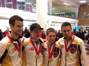 Braden Calvert (second from left) and teammates Kyle Kurz, Lucas Van Den Bosch and Brendan Wilson won their second straightCanadian junior men’s curling championship on Sunday in Corner Brook, Nfld.
