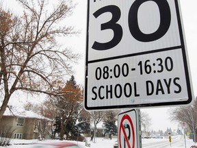 Traffic makes its way through a 30km/h school zone near 106 street and 60 Avenue, in Edmonton Alta., on Monday Feb. 2, 2015. Last Monday over a 1,000 motorists were caught speeding in front of city schools. David Bloom/Edmonton Sun