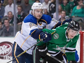 St. Louis Blues defenceman Kevin Shattenkirk (22) checks Dallas Stars forward Antoine Roussel during the NHL play at the American Airlines Center. (Jerome Miron/USA TODAY Sports)