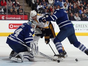 Cody Franson clears traffic from in front of James Reimer during the Maple Leafs’ 9-2 loss to Nashville in November. (Getty Images/AFP)