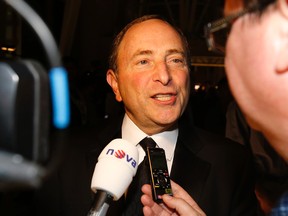 NHL Commissioner Gary Bettman talks to the media on the red carpet at the Hockey Hall of Fame induction ceremony in Toronto on November 17, 2014. (Craig Robertson/Toronto Sun/QMI Agency)