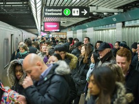 People are pictured recently boarding a a subway at  the Bloor-Yonge Station. (ERNEST DOROSZUK, Toronto Sun)