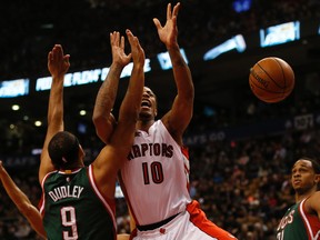 Raptors guard DeMar DeRozan is fouled during Monday night's game against Milwaukee. (JACK BOLAND/Toronto Sun)