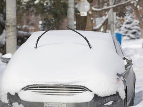 The driver of this car in north Toronto clearly planned ahead of Monday's snowfall. (MICHAEL PEAKE/Toronto Sun)