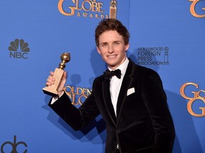 Actor Eddie Redmayne, winner of Best Performance in a Motion Picture - Drama for 'The Theory of Everything,' poses in the press room during the 72nd Annual Golden Globe Awards. (Kevin Winter/Getty Images/AFP)