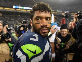 Russell Wilson #3 of the Seattle Seahawks looks on prior to shaking hands with Cam Newton #1 of the Carolina Panthers after their 2015 NFC Divisional Playoff game at CenturyLink Field on January 10, 2015 in Seattle, Washington. (Steve Dykes/Getty Images/AFP)