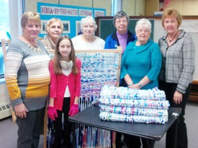 A group at Berea Lutheran Church in Goderich meets weekly to weave mats out of 4L milk bags to give to the homeless. (Front, left to right): Brenda Scholl and Bailey Hamp. (Back, left to right): Lilo Dotterer, Marg Bregman, Marlene Deichert, June Hayter and Heather Ball. (Contributed photo)