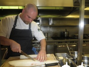 Chef Ryan O’Flynn cubes his fish.