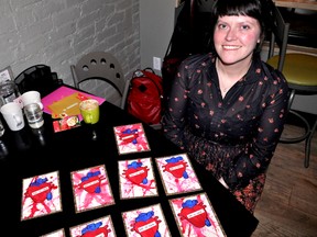 Local correspondence artist Allyson Proulx (aka Lefty Smudges) with some of her homemade Valentine’s Day cards at The Root Cellar in London Ont. Jan. 29, 2015. In collaboration with contemporary visual artist Gozno, Proulx is making the cards available in time for Feb. 14 and is also offering to help Londoners with love letter writing in an upcoming workshop. CHRIS MONTANINI\LONDONER\QMI AGENCY