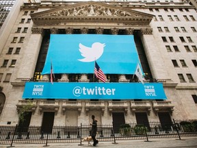 A sign displays the Twitter logo on the front of the New York Stock Exchange ahead of the company's IPO in New York in this Nov. 7, 2013 file photo.  REUTERS/Lucas Jackson
