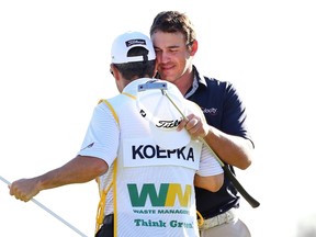Brooks Koepka hugs his caddie during the fourth round of the Waste Management Phoenix Open at TPC Scottsdale on February 1, 2015 in Scottsdale, Arizona.  Maddie Meyer/Getty Images/AFP