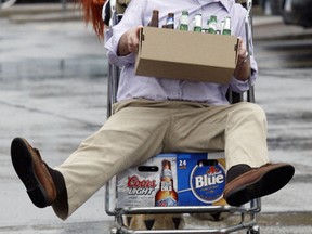 Ottawa West-Nepean MP, John Baird, and Spartacat return some empty beer bottles at the beer store on Baseline Rd. SUN FILES