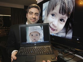 Dr. Cory S. Goldberg holds a laptop with the picture of a 3 year-old Vietnamese girl before cleft lip and palate surgery. Behind him is a larger image of the girl after the surgery. Goldberg is part of a group called Operation Smile helping children all over the world with facial deformities.  

Craig Robertson | Toronto Sun | QMI Agency