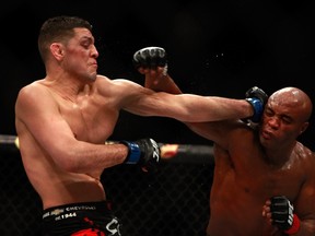 Nick Diaz (L) and Anderson Silva trade punches in their middleweight bout during UFC 183 at the MGM Grand Garden Arena on January 31, 2015 in Las Vegas, Nevada. Silva won by unanimous decision.  Steve Marcus/Getty Images/AFP