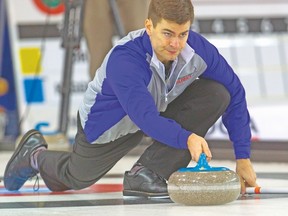 Colin Dow delivers a rock during his 10-2 win in six ends over Jon St. Denis in the third draw on Tuesday at the Ontario Tankard. (MIKE HENSEN/QMI Agency)