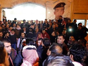 Protesters gather to demonstrate against the Islamic State in front of Islamic State captive Jordanian pilot Mouath al-Kasaesbeh's clan headquarters in Amman February 3, 2015. REUTERS/Stringer