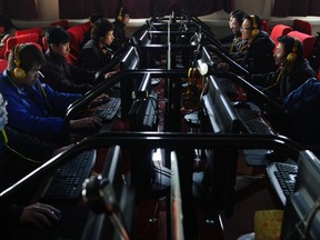 People use computers at an Internet cafe in Changzhi, Shanxi province in this Dec. 30, 2010 file photo.  REUTERS/Stringer