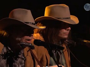 Neil Young performs alongside Jimmy Fallon's 'Neil Young' on the Tonight Show last night. (YouTube screengrab)
