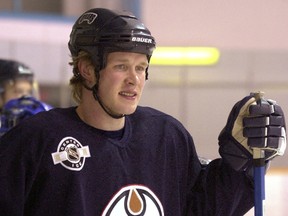 Edmonton Oiler player Janne Niinimaa watches the players go through their paces back in 2003.