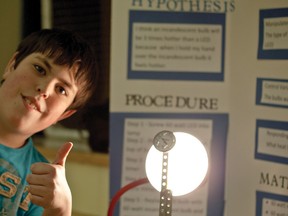 Jacob poses in front of his experiment and display at the Livingstone School science fair. Greg Cowan photos/Pincher Creek Echo.