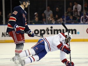 Chris Kreider of the New York Rangers takes a first period penalty for unsportsmanlike conduct and P.K. Subban of the Montreal Canadiens takes a penalty for embellishment during the first period at Madison Square Garden on January 29, 2015. (Bruce Bennett/Getty Images/AFP)