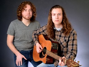 Fanshawe students Jesse Nestor, left, and Justin Meli joined forces for a heartfelt version of an original song, Family Situation, during Tuesday?s newsroom video shoot. (MORRIS LAMONT, The London Free Press)