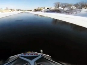 A daredevil snowmobiler filmed himself riding over water on the Sainte-Anne River, which has caught the attention of Quebec provincial police. (TVA)