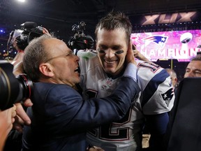 New England Patriots quarterback Tom Brady is congratulated by team president Jonathan Kraft after defeating the Seattle Seahawks in the NFL Super Bowl XLIX football game in Glendale, Arizona February 1, 2015.  (REUTERS)