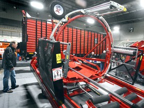 Big equipment like this Anderson round-bale wrapper is on display at the Canadian Dairy XPO at Stratford Rotary Complex. Some 350 exhibitors from around the globe are showing the latest in farm technology at the event, which concludes Thursday. (SCOTT WISHART/The Beacon Herald)