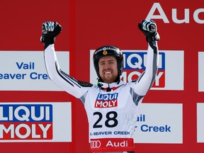 Dustin Cook of Canada celebrates at the flower ceremony after placing second in the men's Super G in the FIS alpine skiing world championships at Birds of Prey Racecourse on Feb. 5, 2015. (Jeff Swinger-USA TODAY Sports)