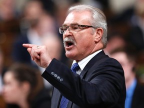 Canada's Agriculture Minister Gerry Ritz speaks during Question Period in the House of Commons on Parliament Hill in Ottawa December 4, 2014. REUTERS/Chris Wattie