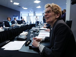 Ontario Premier Kathleen Wynne waits for the start of a meeting of provincial and territorial premiers in Ottawa January 30, 2015. (REUTERS/Chris Wattie)