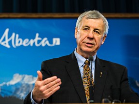 Alberta finance minister Robin Campbell speaks about reaching out to Albertans for feedback regarding the 2015 budget and the current financial problems facing the province at the Alberta Legislature Building in Edmonton, Alta., on Thursday, Feb. 5, 2015. Codie McLachlan/Edmonton Sun/QMI Agency