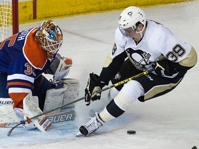 Penguins forward David Perron is stopped by Viktor Fasth during the second period of Wednesday's game. Perron ran over Fasth at one point in the game, sparking a heated outburst from the goalie. (David Bloom, Edmonton Sun)