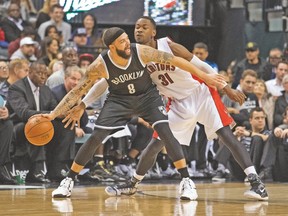 Brooklyn Nets guard Deron Williams dribbles against Raptors forward Terrence Ross during Wednesday night’s game at the Air Canada Centre. (USA TODAY SPORTS)