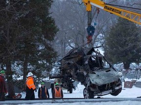 The vehicle that was struck by a commuter train is lifted from the tracks in Mount Pleasant, near Valhalla, New York, February 4, 2015. REUTERS/Shannon Stapleton