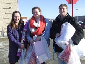 Cambrian College students, left to right, Eden Matijevich, Corey MacLeod, and Cole Bailey, were among the many shoppers who turned out for the first day of the liquidation sale at the Target store on Thursday. HAROLD CARMICHAEL/SUDBURY STAR