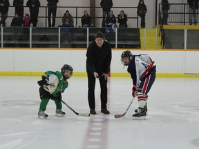 Former NHL star and Seaforth native Boyd Devereaux drops the puck for the ceremonial opening faceoff Friday at the sixth annual Doug Perkes Memorial Peewee Tournament in Seaforth. (Marco Vigliotti Huron Expositor)