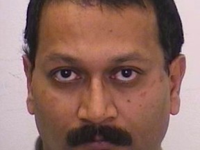 Rupen Balaram-Sivaram, 51, of Toronto, is accused of threatening to kill high-ranking government, military and police officials in Ontario. (Toronto Police handout)