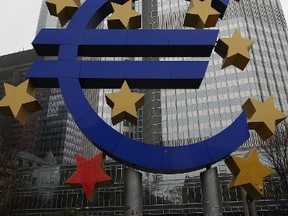 (FILES) This photo taken on January 26, 2015 shows the euro sign sculpture in front of the building that used to host the headquarters of the European Central Bank ( ECB ) in Frankfurt am Main, western Germany. By taking a tough line on Greece, the European Central Bank is sending a signal that while it has repeatedly charged to the eurozone's rescue in the past, it is no longer willing to do governments' work for them, analysts said on February 5, 20145.  AFP PHOTO / DANIEL ROLAND